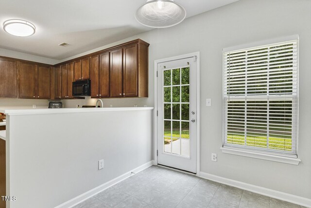 160 Chandler Springs Dr, Holly Springs, NC 27540 - kitchen featuring black microwave and light countertops