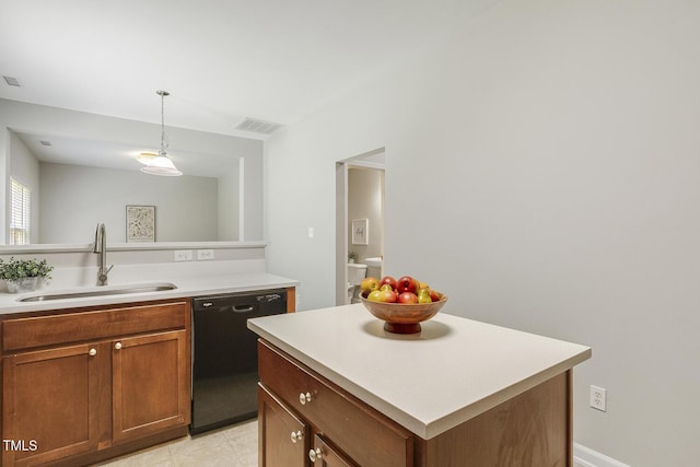 160 Chandler Springs Dr, Holly Springs, NC 27540 - kitchen featuring black dishwasher, light countertops, pendant lighting, and brown cabinets