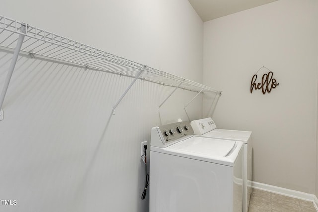 160 Chandler Springs Dr, Holly Springs, NC 27540 - washroom featuring washing machine and dryer and light tile patterned floors