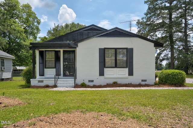 407 W Pippen St, Whitakers, NC 27891 - view of front facade with crawl space, brick siding, and entry steps