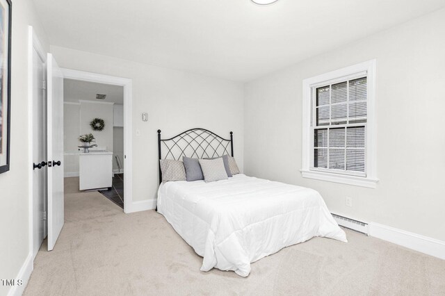 407 W Pippen St, Whitakers, NC 27891 - bedroom featuring baseboard heating and carpet floors
