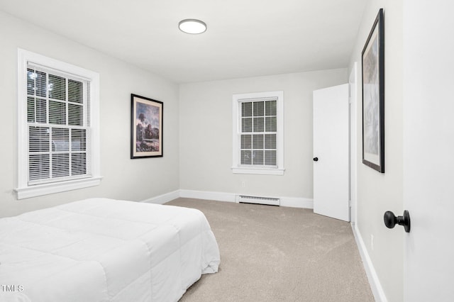 407 W Pippen St, Whitakers, NC 27891 - carpeted bedroom featuring baseboard heating and baseboards