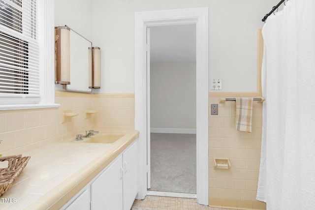407 W Pippen St, Whitakers, NC 27891 - full bathroom with vanity, curtained shower, and tile walls