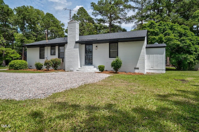 407 W Pippen St, Whitakers, NC 27891 - ranch-style home with a chimney, brick siding, a front yard, a shingled roof, and crawl space