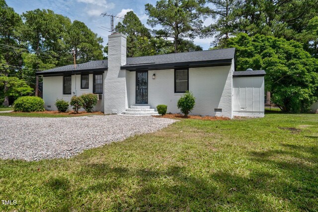 407 W Pippen St, Whitakers, NC 27891 - ranch-style home with a chimney, brick siding, a front yard, a shingled roof, and crawl space