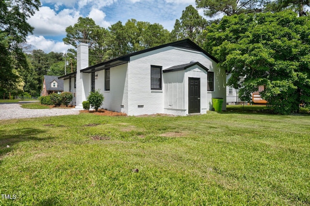 407 W Pippen St, Whitakers, NC 27891 - view of front of home featuring a chimney, crawl space, and a front lawn