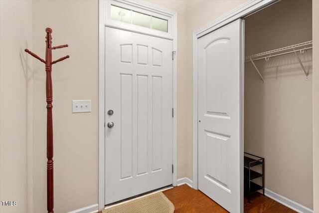 1213 Silver Beach Way, Raleigh, NC 27606 - entryway with dark wood-style flooring and baseboards