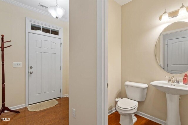1213 Silver Beach Way, Raleigh, NC 27606 - bathroom with wood finished floors and ornamental molding