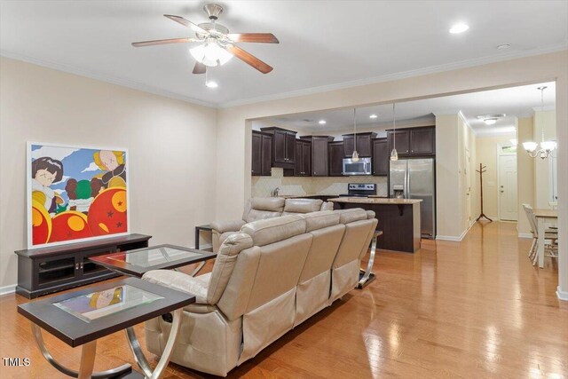 1213 Silver Beach Way, Raleigh, NC 27606 - living area featuring ceiling fan, light wood-style floors, a chandelier, crown molding, and recessed lighting