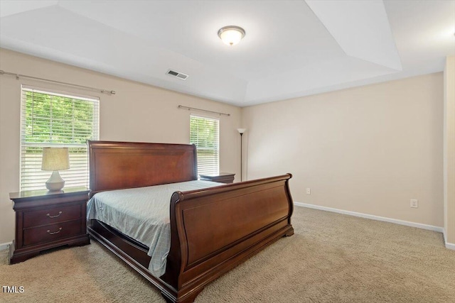 1213 Silver Beach Way, Raleigh, NC 27606 - bedroom featuring light colored carpet and a tray ceiling