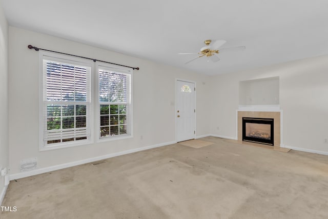 4825 Windbreak Ln, Raleigh, NC 27616 - unfurnished living room with a tiled fireplace, carpet, and ceiling fan