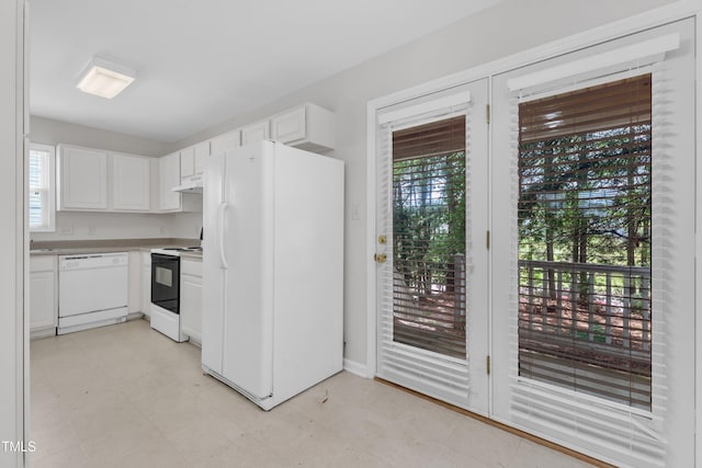 4825 Windbreak Ln, Raleigh, NC 27616 - kitchen featuring white appliances, under cabinet range hood, white cabinets, and light countertops