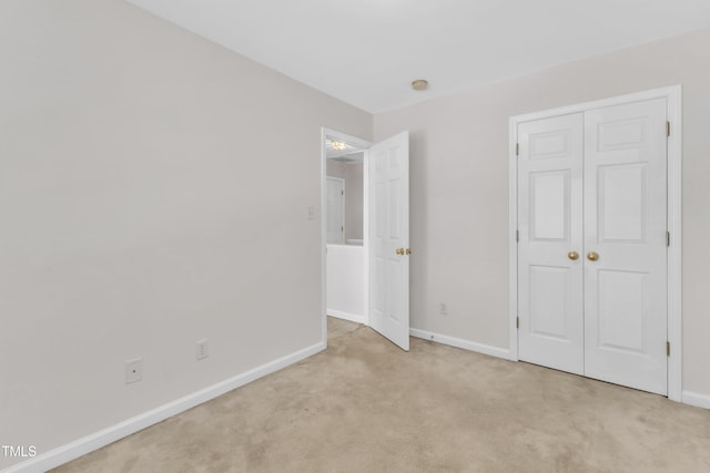 4825 Windbreak Ln, Raleigh, NC 27616 - unfurnished bedroom featuring light colored carpet and a closet