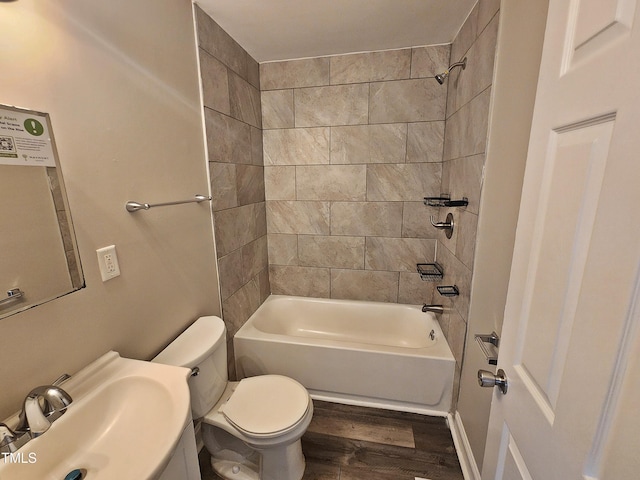 511 Commonwealth St, Durham, NC 27703 - full bath featuring wood finished floors, bathing tub / shower combination, and vanity