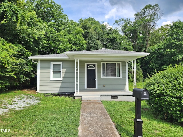 511 Commonwealth St, Durham, NC 27703 - bungalow with a porch, a front lawn, and a shingled roof
