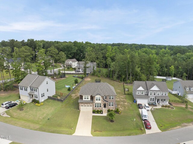 433 Village Bend Dr, Fuquay Varina, NC 27526 - aerial perspective of suburban area featuring a heavily wooded area