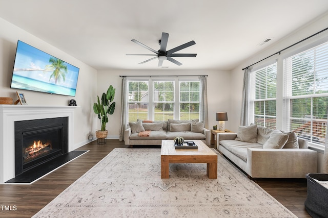 433 Village Bend Dr, Fuquay Varina, NC 27526 - living area with ceiling fan, dark wood finished floors, and a glass covered fireplace