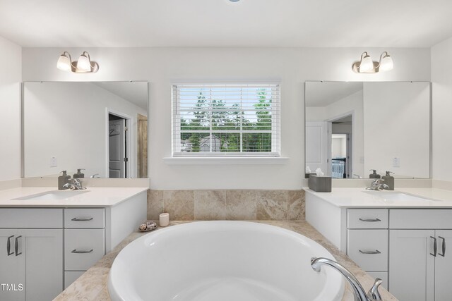 433 Village Bend Dr, Fuquay Varina, NC 27526 - bathroom with two vanities and a bath
