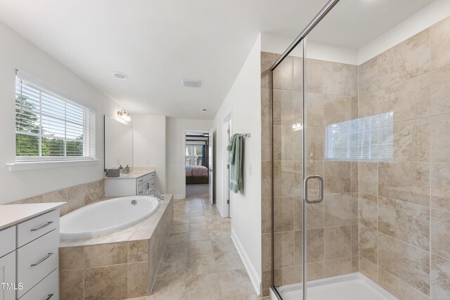 433 Village Bend Dr, Fuquay Varina, NC 27526 - ensuite bathroom with vanity, a shower stall, plenty of natural light, and a garden tub