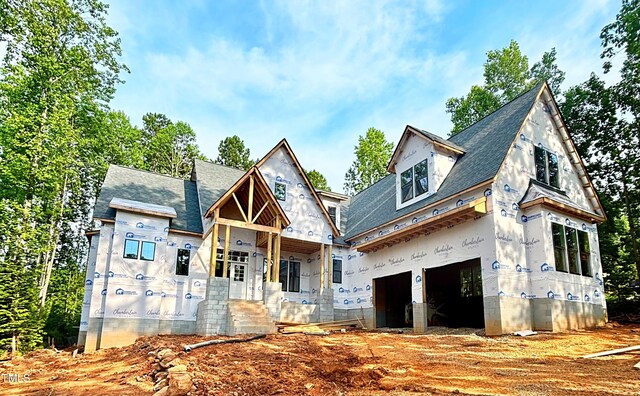 8 Pin Tail Ct, Pittsboro, NC 27312 - view of front facade featuring a garage and a shingled roof