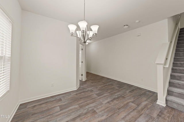 908 Adelphia Rd, Fuquay Varina, NC 27526 - unfurnished dining area with stairs, dark wood-type flooring, and a chandelier