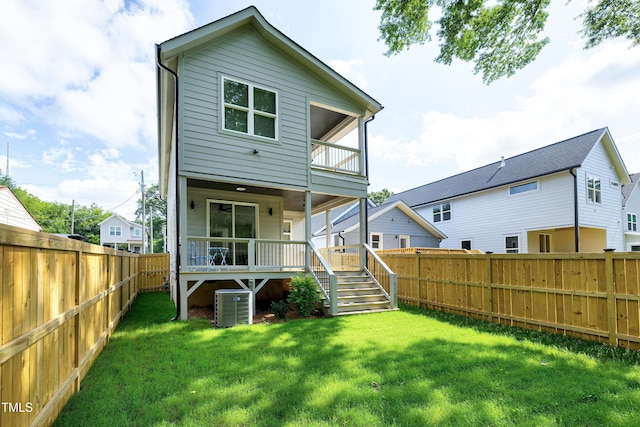 1410 Joe Louis Ave, Raleigh, NC 27610 - rear view of property featuring a fenced backyard, a balcony, stairs, and a wooden deck