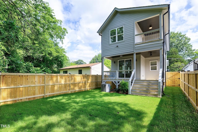 1410 Joe Louis Ave, Raleigh, NC 27610 - back of property with a fenced backyard, a balcony, and a gate