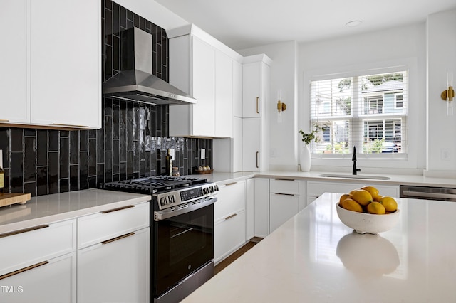 1410 Joe Louis Ave, Raleigh, NC 27610 - kitchen with stainless steel range with gas stovetop, wall chimney range hood, light countertops, white cabinets, and decorative backsplash