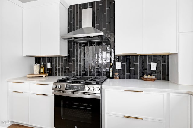1410 Joe Louis Ave, Raleigh, NC 27610 - kitchen featuring gas stove, wall chimney range hood, backsplash, light countertops, and white cabinetry