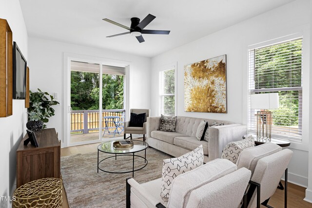 1410 Joe Louis Ave, Raleigh, NC 27610 - living room with wood finished floors, healthy amount of natural light, and a ceiling fan