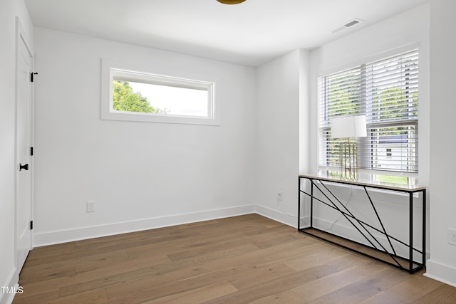 1410 Joe Louis Ave, Raleigh, NC 27610 - spare room with wood finished floors and baseboards