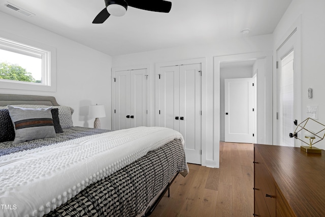 1410 Joe Louis Ave, Raleigh, NC 27610 - bedroom with light wood finished floors, multiple closets, and ceiling fan