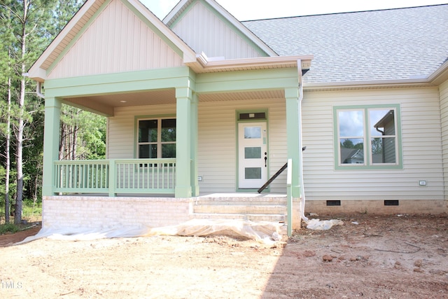 70 Basil Ct, Franklinton, NC 27525 - view of front facade featuring a porch, crawl space, board and batten siding, and roof with shingles