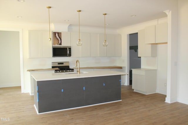 70 Basil Ct, Franklinton, NC 27525 - kitchen featuring stainless steel appliances, white cabinetry, and light wood-type flooring