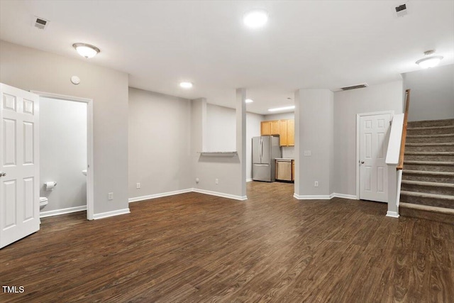 330 Gilman Ln Unit 109, Raleigh, NC 27610 - unfurnished living room with dark wood-style flooring, stairway, and recessed lighting