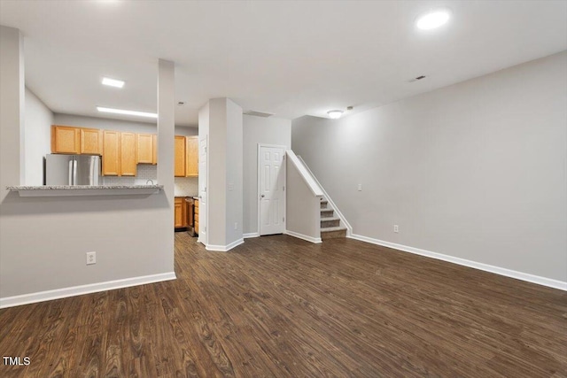 330 Gilman Ln Unit 109, Raleigh, NC 27610 - unfurnished living room with stairway and dark wood-style floors