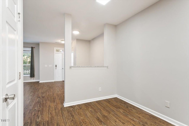 330 Gilman Ln Unit 109, Raleigh, NC 27610 - spare room with baseboards and dark wood finished floors