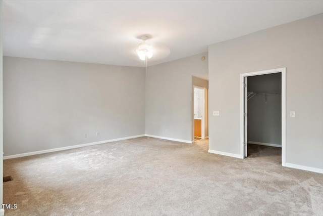 330 Gilman Ln Unit 109, Raleigh, NC 27610 - unfurnished bedroom featuring carpet flooring, lofted ceiling, a walk in closet, and a closet