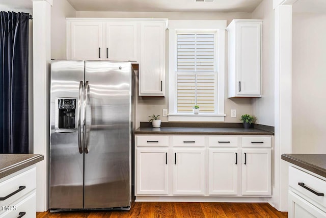 1168 Great Ridge Parkway, Chapel Hill, NC 27516 - kitchen with stainless steel fridge with ice dispenser, dark countertops, white cabinets, and dark wood-style floors
