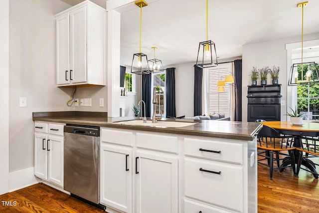 1168 Great Ridge Parkway, Chapel Hill, NC 27516 - kitchen featuring dishwasher, dark countertops, a peninsula, dark wood-type flooring, and a chandelier