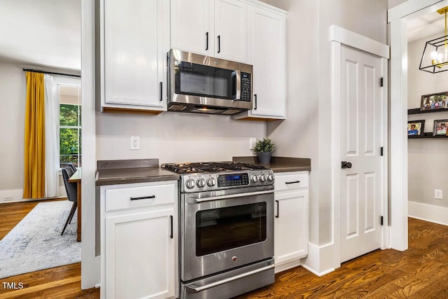 1168 Great Ridge Parkway, Chapel Hill, NC 27516 - kitchen with stainless steel appliances, dark countertops, dark wood-type flooring, and white cabinetry