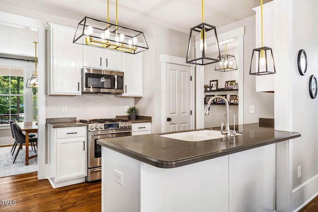 1168 Great Ridge Parkway, Chapel Hill, NC 27516 - kitchen with appliances with stainless steel finishes, dark countertops, dark wood-style floors, and white cabinets