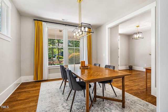 1168 Great Ridge Parkway, Chapel Hill, NC 27516 - dining space featuring a chandelier and dark wood-style flooring