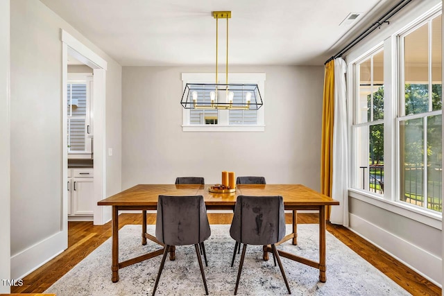 1168 Great Ridge Parkway, Chapel Hill, NC 27516 - dining area featuring dark wood-style flooring and a chandelier