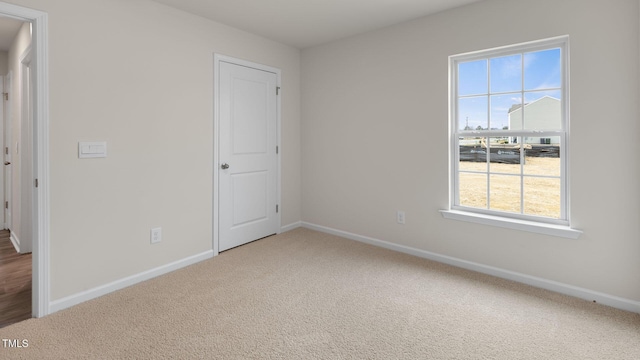 100 Grove Ln, Goldsboro, NC 27534 - unfurnished bedroom with carpet flooring and baseboards