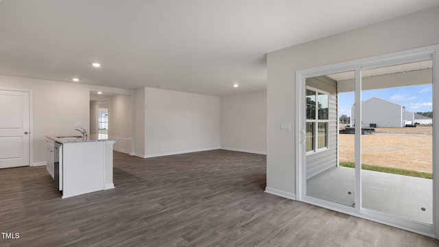 100 Grove Ln, Goldsboro, NC 27534 - unfurnished living room featuring plenty of natural light, recessed lighting, and dark wood-type flooring