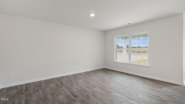 100 Grove Ln, Goldsboro, NC 27534 - empty room featuring dark wood finished floors and recessed lighting