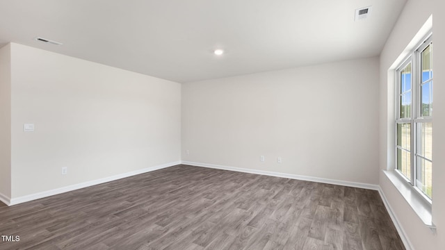100 Grove Ln, Goldsboro, NC 27534 - unfurnished room with healthy amount of natural light, wood finished floors, and recessed lighting