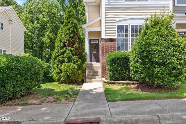 7856 Spungold St, Raleigh, NC 27617 - view of exterior entry featuring brick siding