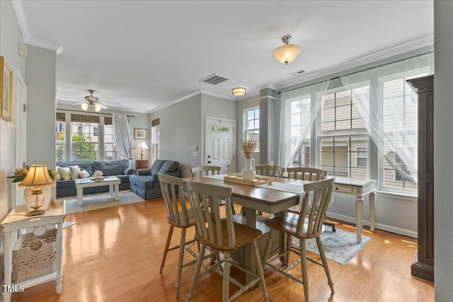 7856 Spungold St, Raleigh, NC 27617 - dining area featuring crown molding, light wood-type flooring, and ceiling fan